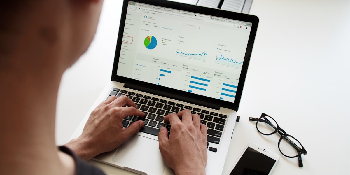 Analyst reviewing a data dashboard with charts and KPIs, representing the IT market as a public scoreboard